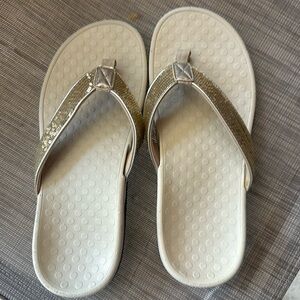 Like new!  Vionic flip flops - light brown/gold.
